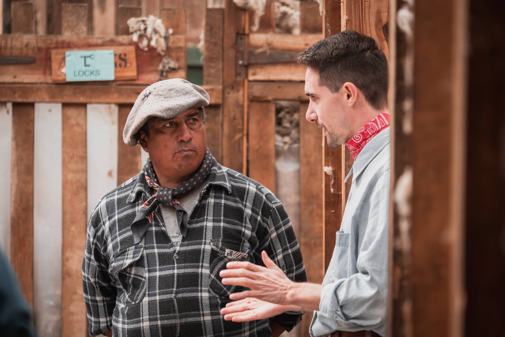 Two colleagues at the wooden stalls